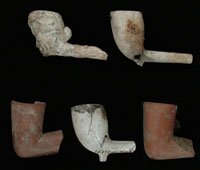 Figure10. A variety of tobacco pipes recoveredfrom theBoston Saloon; theredclaypipebowls represent a unique stylefoundat theBoston Saloon.